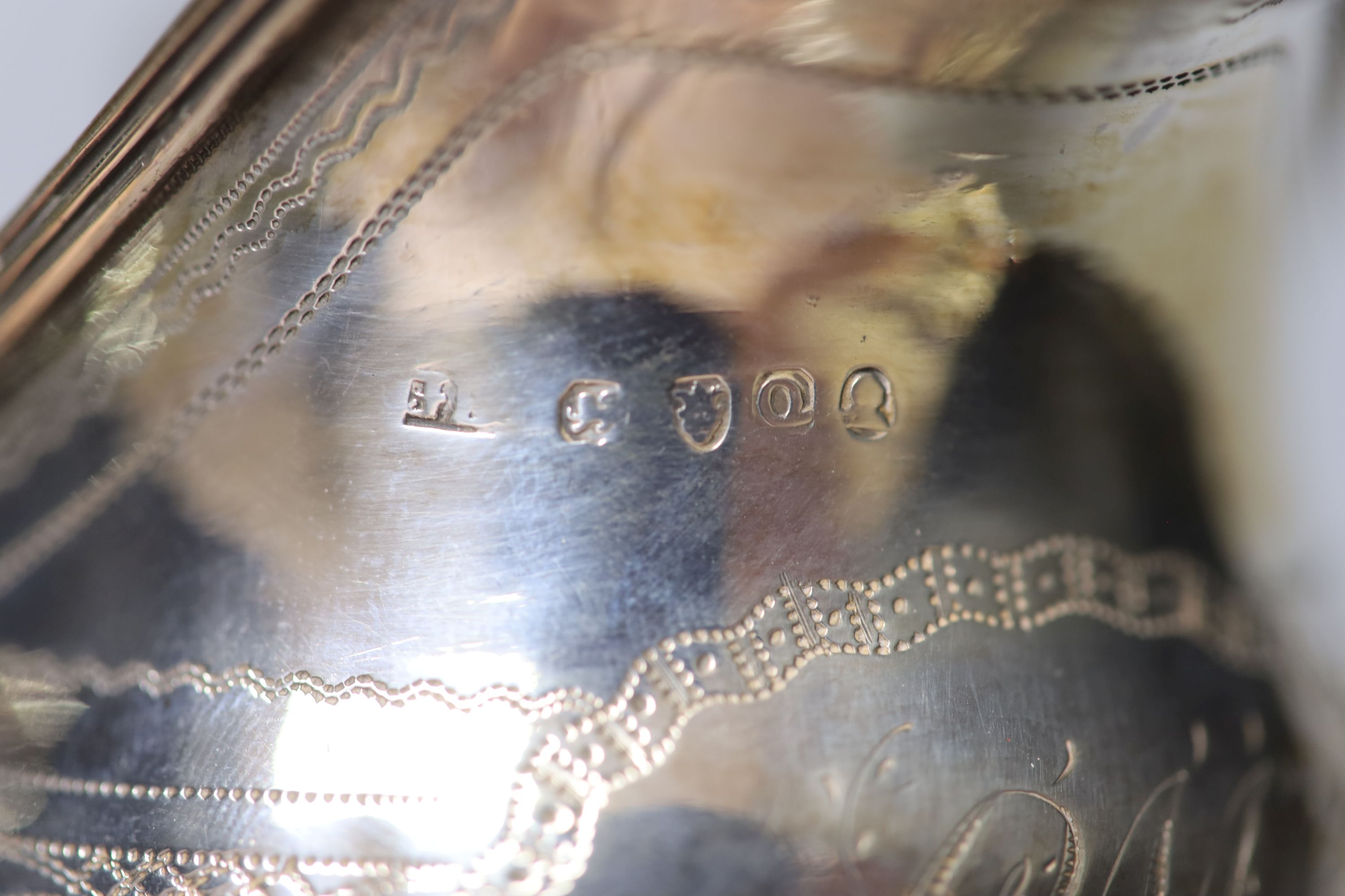 A George III silver cream jug, with engraved monogram, London, 1811, height 72mm, 92 grams.